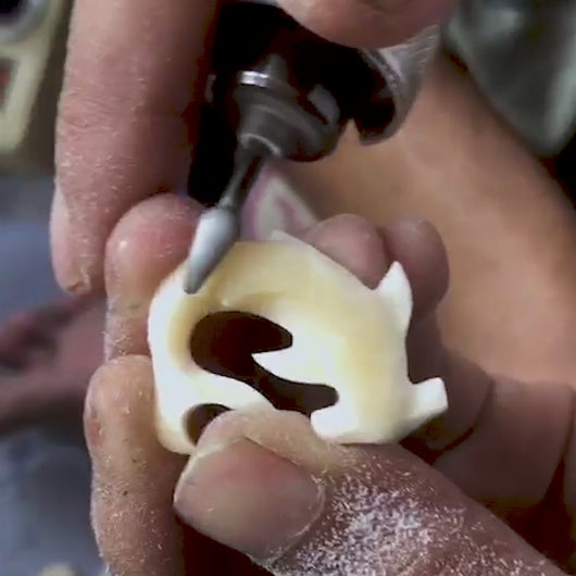 Bali Necklaces artist hand carving our hammerhead Shark Bracelet.